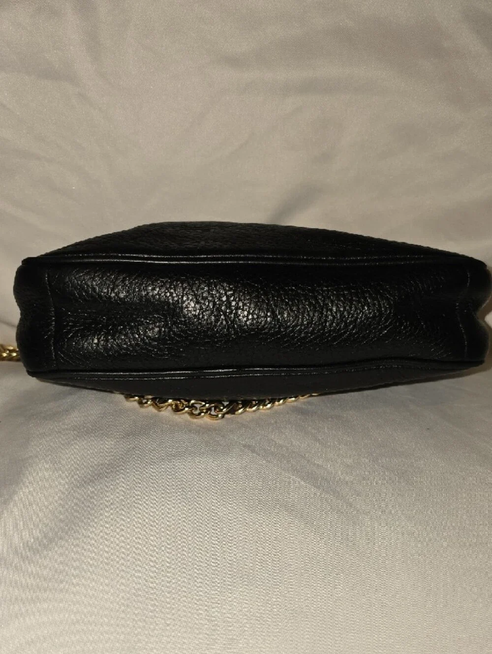 Coach Black Leather Mini Wristlet with Gold Chain 8' L x 5' H.